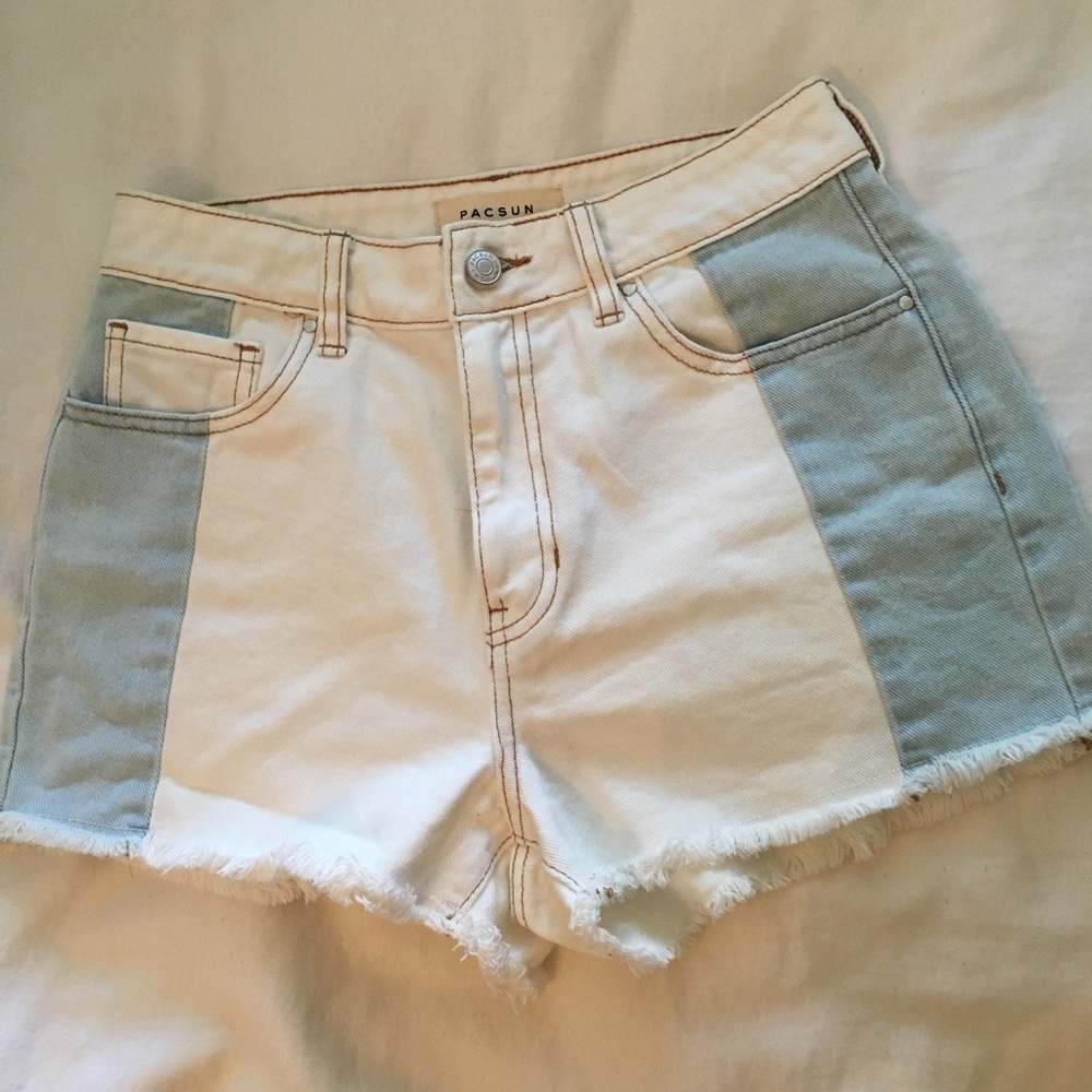 White and light blue jean shorts.